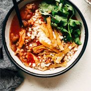 Chicken Tortilla Soup in a bowl with a spoon. There's a banner above that says "Chicken Tortilla Soup"
