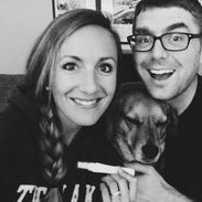 A happy couple with their dog.