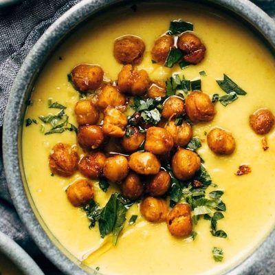 Golden Soup in bowls with chickpea topping.