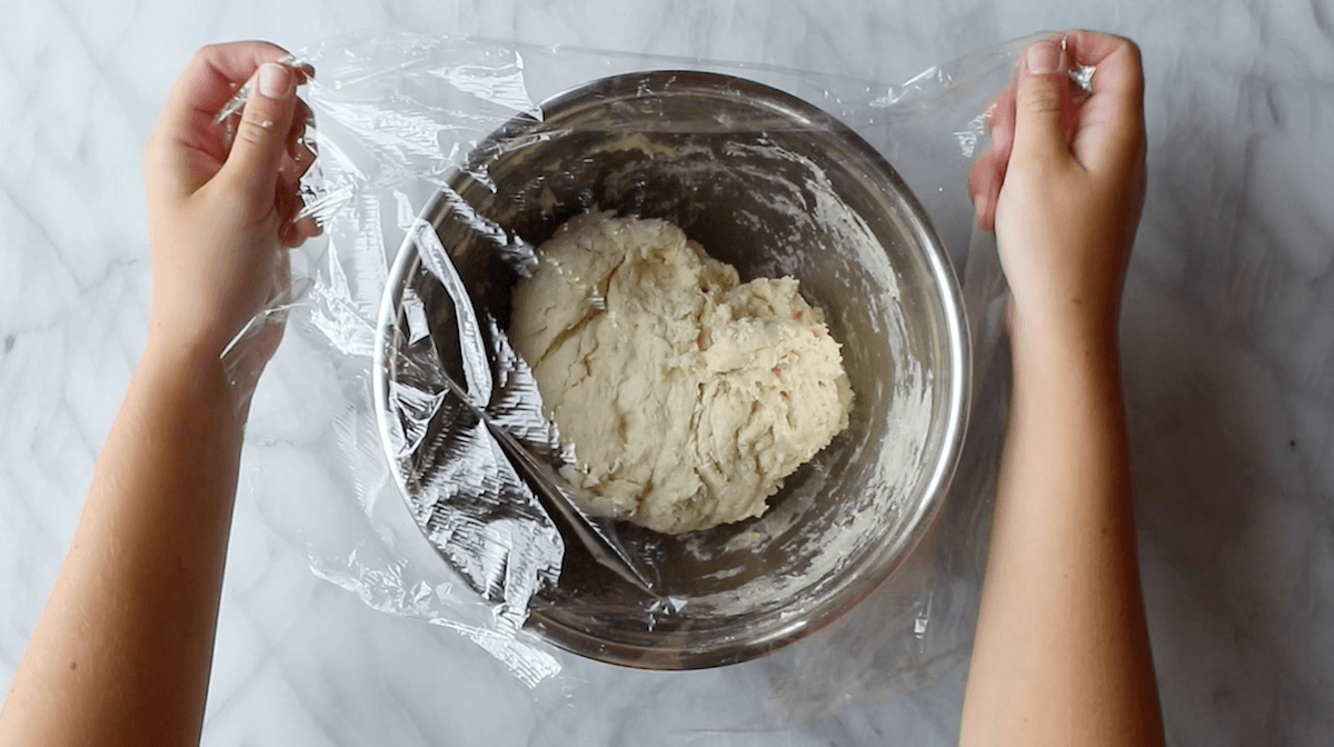 Resting dough in covered bowl.